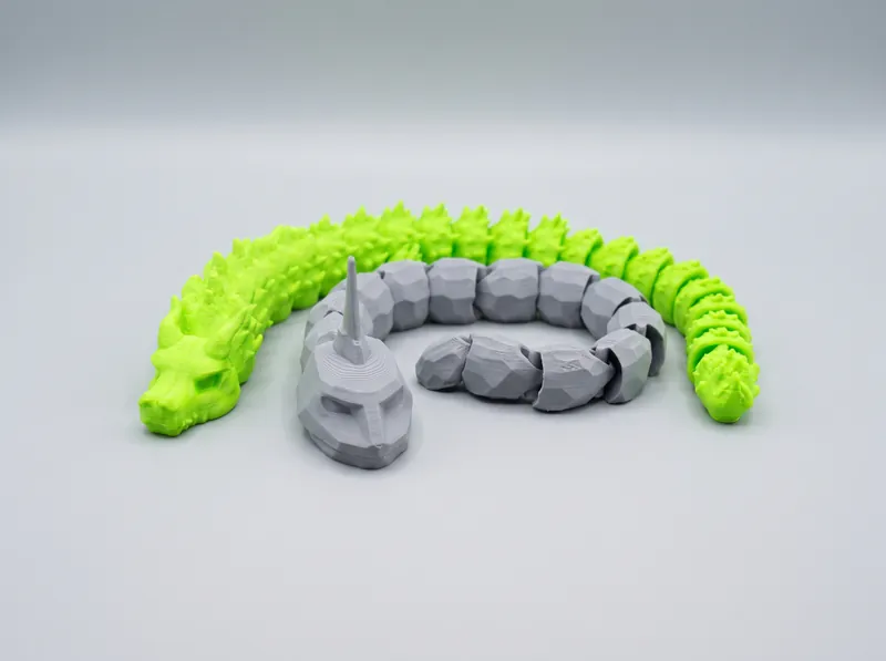 Figura articulada impressa em 3D FDM com elos móveis fabricados diretamente na mesa